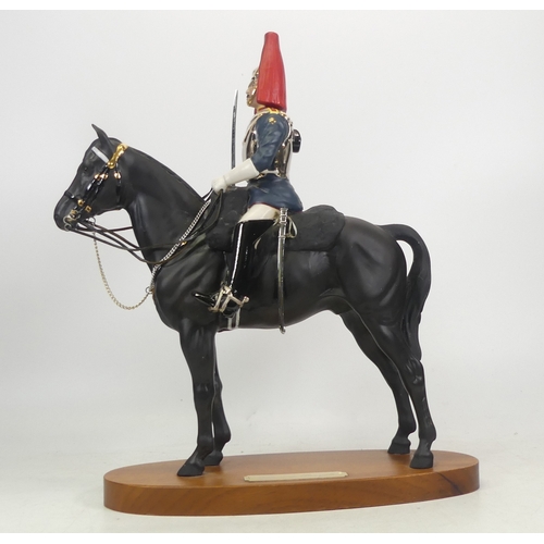 200 - Royal Doulton Connoisseur model of mounted Queens Guardsman ''Blues and Royals'', height 38cm. (a/f)