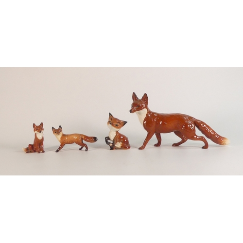 416 - Beswick large standing fox 1016A, small standing fox 1440, small seated fox 1748 and comical fox 173... 