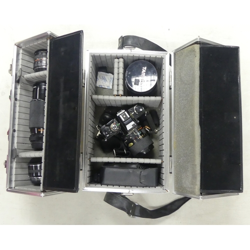 697 - Minolta X-700 black body complete with a selection of lenses including Minolta 35-70mm Zoom Lens, Ki... 