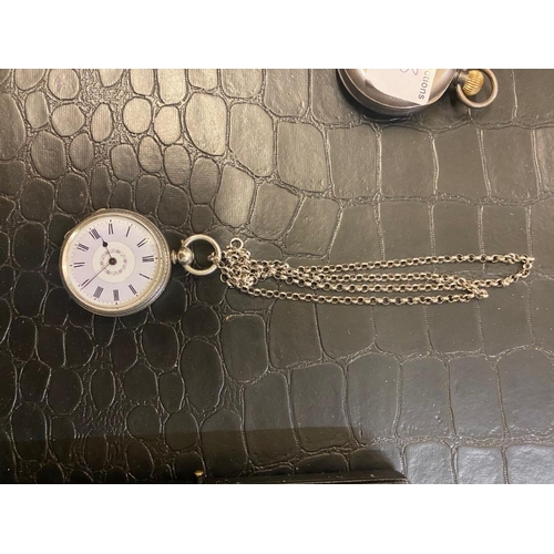 692 - Silver Cased Ladies Open Faced Pocket Watch together with Rolo Link Chain. Pretty Lilac Shade enamel... 