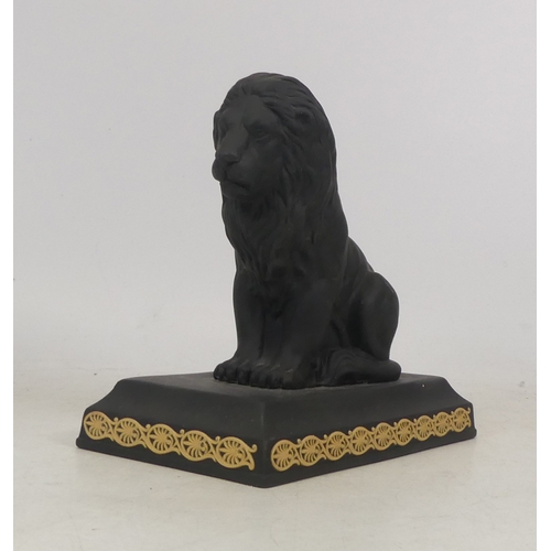 261 - Wedgwood  black basalt seated lion paperweight, applied with cane yellow sprig decoration, height 14... 