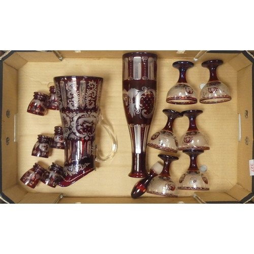 327 - Bohemian Ruby Red Glassware to include Large Decanter, Water Jug, Six Wine glasses and Six Shot glas... 