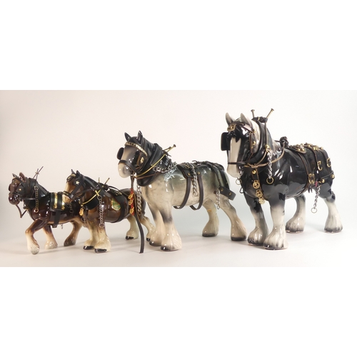 78 - Four shire horses in working harness to include Melba ware (4)