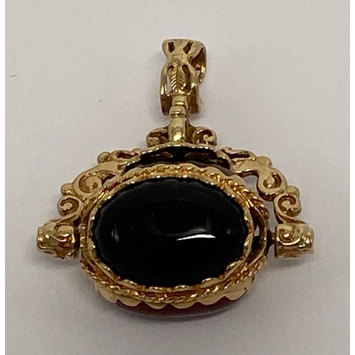 631 - 9ct gold ornate swivel fob set with three various coloured agate stones,7.5g.