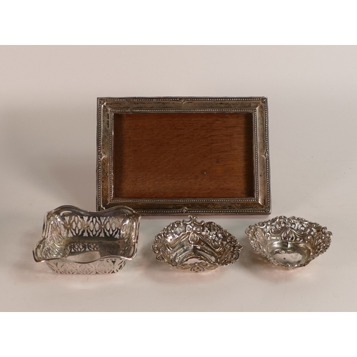 790 - A collection of Silver items including pair heart shaped pierced dishes, square dish, 62g and photo ... 