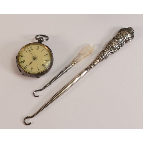 709 - Ladies Silver fob watch, Silver handled and mother of pearl button hooks. (3)