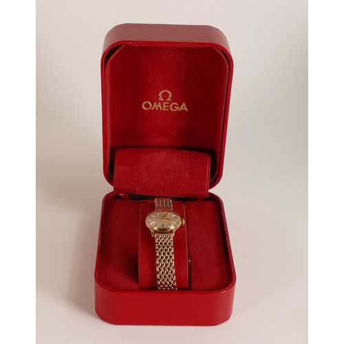 716 - 9ct gold ladies Omega wristwatch with 9ct gold bracelet, 31.4g, in original box.