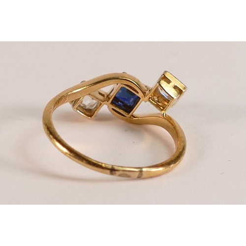 717 - 18ct Gold ring set with square cut Sapphire surrounded by two square cut Diamonds, size L, 2.3g.