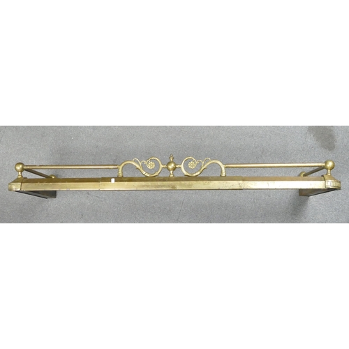 683 - An Extending Brass Fire Fender with Cast Iron weight inside. Length: 134cm