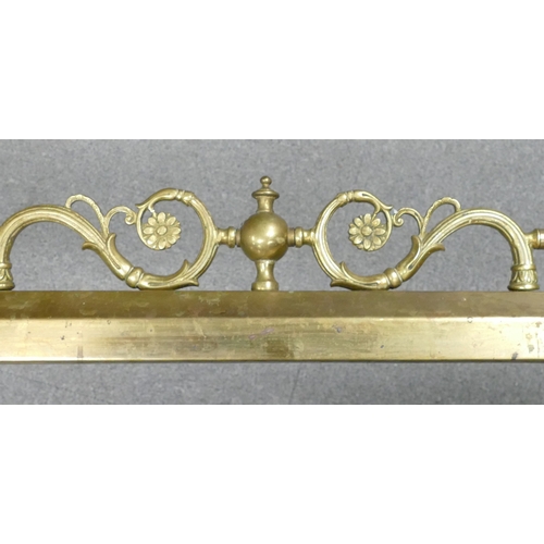 683 - An Extending Brass Fire Fender with Cast Iron weight inside. Length: 134cm