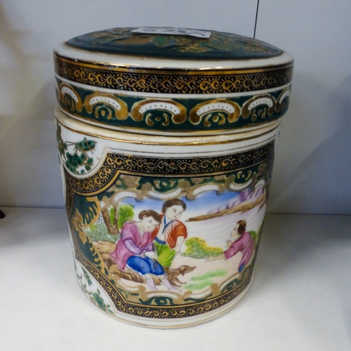 72 - 20th Century Chinese export porcelain tea caddie and cover decorated with Garden scenes, h.15cm.