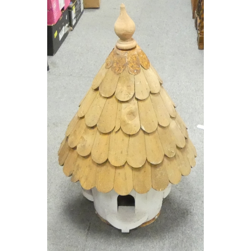 543A - Wooden dove coat painted white, can fit wine bottles, height 75cm.