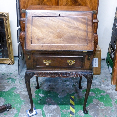 693 - Small Oak Fall Front Writing Desk on tall cabriole legs.
Measuires - H95.5cm