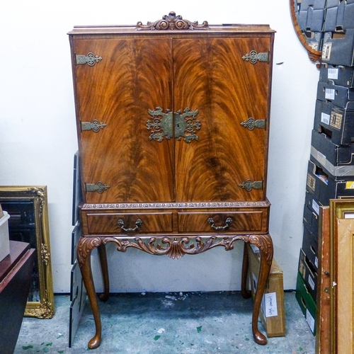 694 - Reproduction Burr Walnut Cocktail Cabinet on tall cabriole legs with mirrored interior.
Measures - H... 