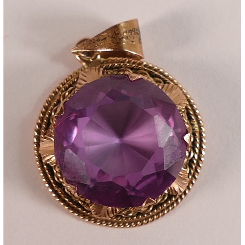 815 - Victorian yellow metal rose coloured ornate pendant, set with round amethyst stone which is 1.25cm d... 