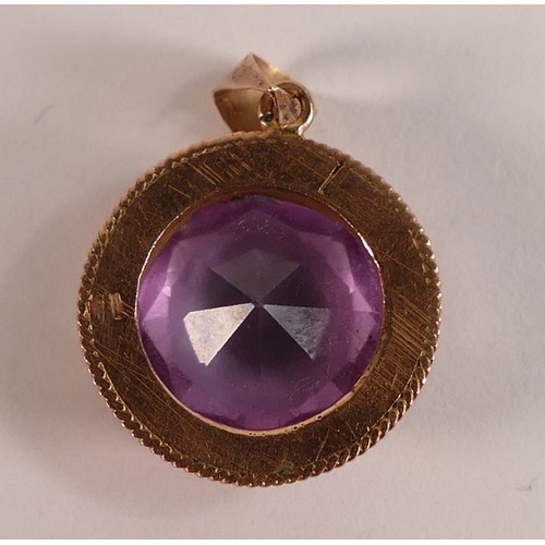 815 - Victorian yellow metal rose coloured ornate pendant, set with round amethyst stone which is 1.25cm d... 