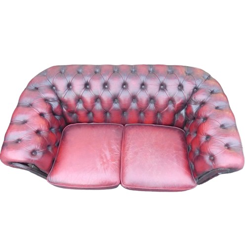 529C - Two Seater Ox-Blood Chesterfield Settee. Distressed Leather. Height: 75cm Width: approx. 160cm Depth... 