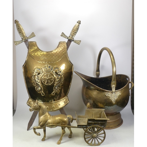 76 - A Selection Of Brass Including Horse & Cart, Footed Coal Scuttle and a Chest Shield & Swords Display... 