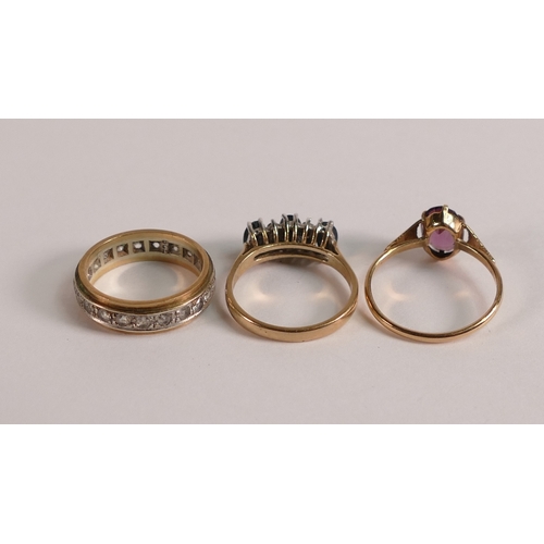 733 - 9ct gold eternity ring, and two 9ct gold stone set rings, 6.1g. (3)