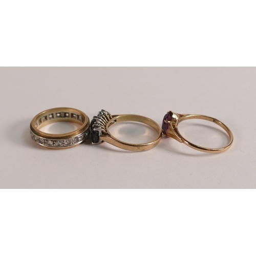 733 - 9ct gold eternity ring, and two 9ct gold stone set rings, 6.1g. (3)