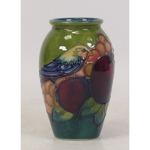 138 - Moorcroft, Small Vase in the Finch and Berries Design on Green Ground. Height: 10cm