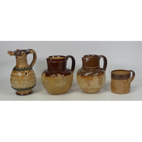 140 - Doulton Lambeth, Three Jugs to include Puzzle Jug a/f and two smaller jugs. Height of tallest: 17.5c... 