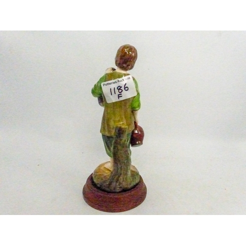 10 - Reg Johnson figure A Cottage Girl with Dog and Pitcher, on turned wooden base.