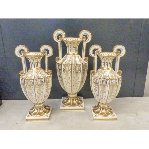 219 - A suite of three Davenport white and gilt twin handled vases,  some hairline cracks noted, height of... 