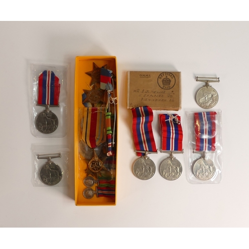 696 - WWII Medals: An assorted collection of medals, includes loose medals, Six 1939-45 War Medals and an ... 