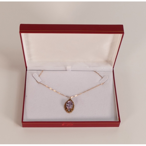 742 - 9ct rose gold pendant & necklace, the pendant set with oval purple stone, 4.7g.