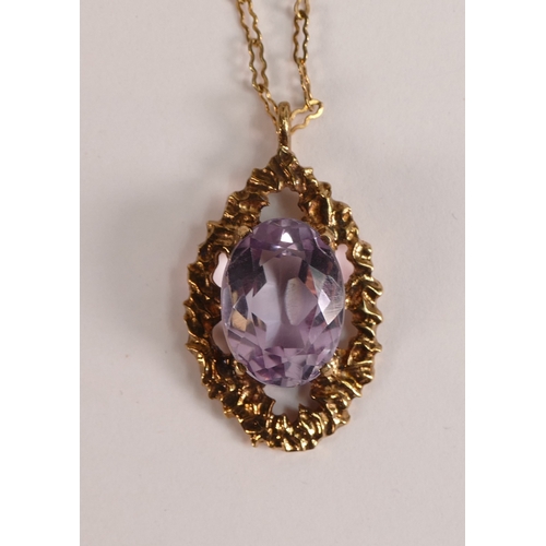 742 - 9ct rose gold pendant & necklace, the pendant set with oval purple stone, 4.7g.