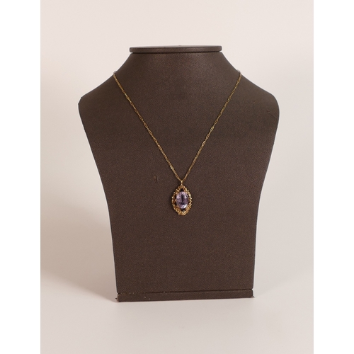 742 - 9ct rose gold pendant & necklace, the pendant set with oval purple stone, 4.7g.