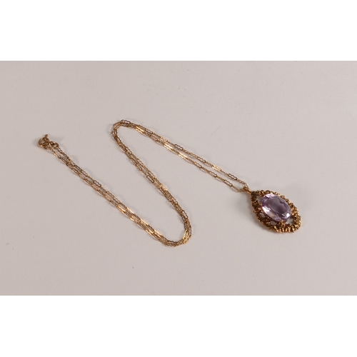 742 - 9ct rose gold pendant & necklace, the pendant set with oval purple stone, 4.7g.