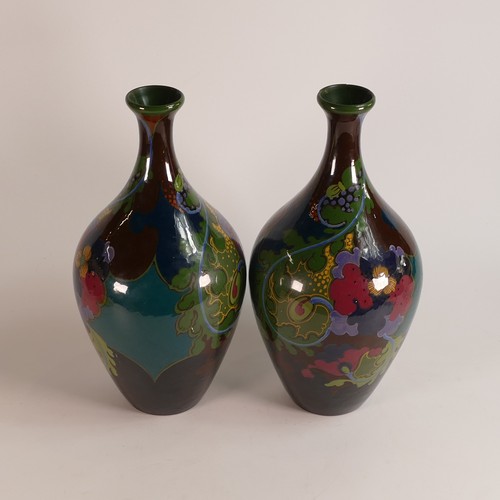 61 - Gouda of Holland, pair of Ivora vases of elongated ovoid form with flared rim. Painted with stylised... 