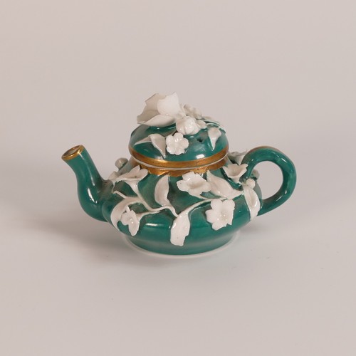 82 - Five 19th century florally encrusted porcelain items, including green tea pot with white floral and ... 