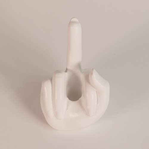 91 - Anissa Kermiche candlestick in the form of a hand with a raised middle finger 'French For Goodnight'... 