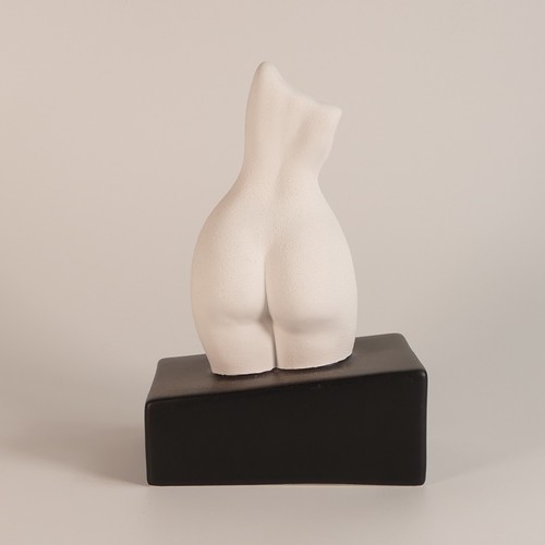 93 - Anissa Kermiche Happy Bookend, white textured figure. Height 23cm