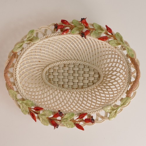 102 - Belleek, florally encrusted woven porcelain basket. Bears the 8th 'Belleek' Blue mark used from 1993... 