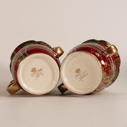 114 - Crown Devon, three red lustre vases to include a pair of garden scene loop handled examples and a la... 