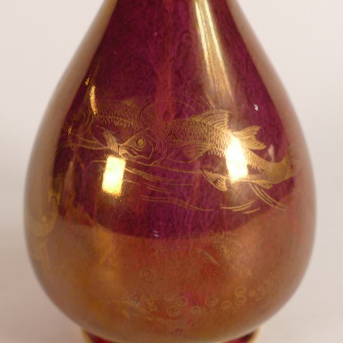 117 - Likely Pilkington Lancastrian, early 20th century purple Lustre vase with gilt fish designs. Height:... 