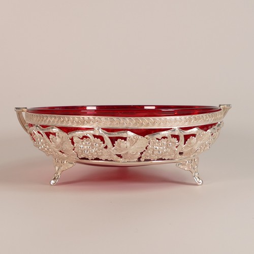 124 - Silvered basket with swing handle supporting a Cranberry glass bowl. (D: 21.5cm)