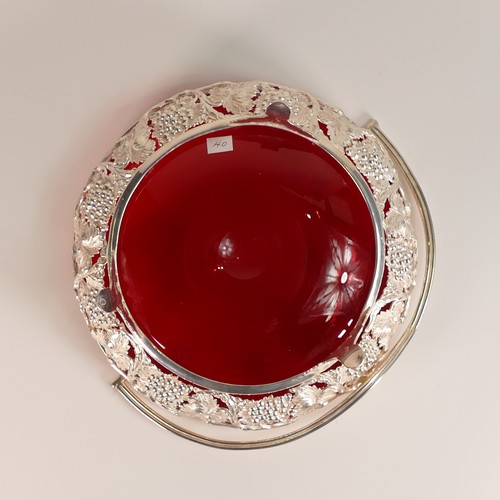 124 - Silvered basket with swing handle supporting a Cranberry glass bowl. (D: 21.5cm)