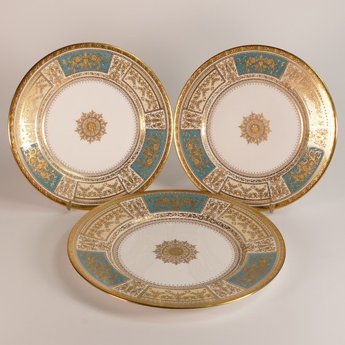 233 - Minton, three heavily gilt light blue ground porcelain plates. Includes dinner plate and two salad p... 