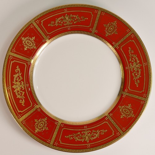 236 - Minton, two heavily gilt dinner plates. Heavily gilt with light blue and red ground panels with elab... 