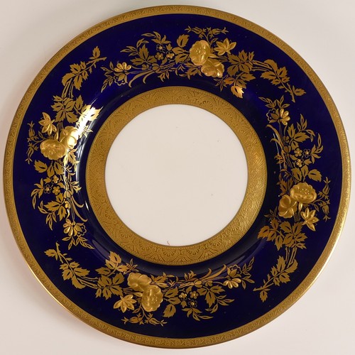 239 - Minton, four heavily gilt side plates. Cobalt blue ground border with elaborate raised gilt patterns... 