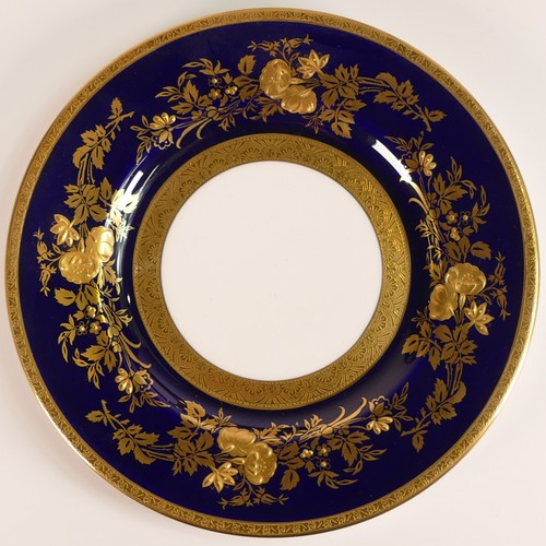 239 - Minton, four heavily gilt side plates. Cobalt blue ground border with elaborate raised gilt patterns... 