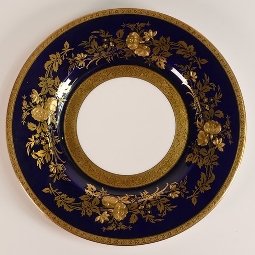 239 - Minton, four heavily gilt side plates. Cobalt blue ground border with elaborate raised gilt patterns... 