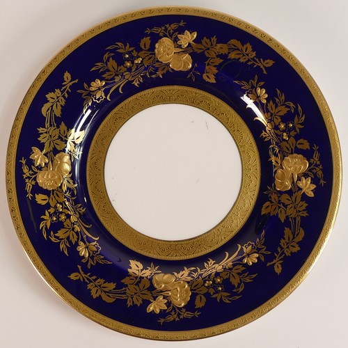 239 - Minton, four heavily gilt side plates. Cobalt blue ground border with elaborate raised gilt patterns... 