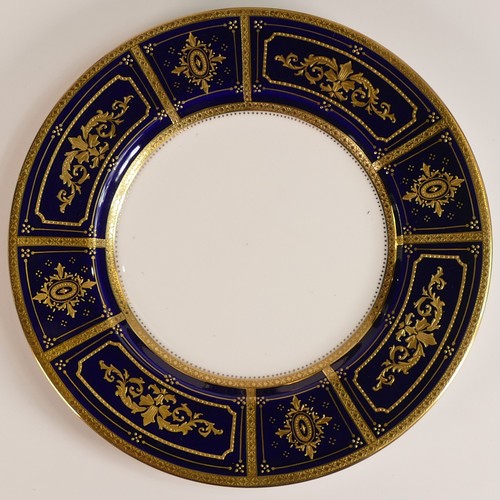 240 - Minton, six heavily gilt plates. One 23cm heavily gilt with Cobalt ground border and elaborate raise... 