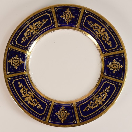 240 - Minton, six heavily gilt plates. One 23cm heavily gilt with Cobalt ground border and elaborate raise... 